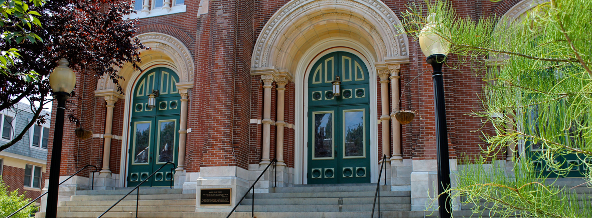 outside of the church doors with large stone arches